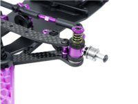 Medium/Firm Green roll center o-ring on a Prodigy pivot setup, with a coil spring and purple anodized hardware visible in a flex assembly.