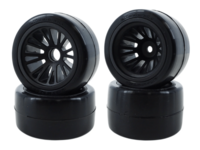 eXcelerate F1 carpet tire set showing black front and rear tires on F1 wheels with a visible 14mm hex wheel design.